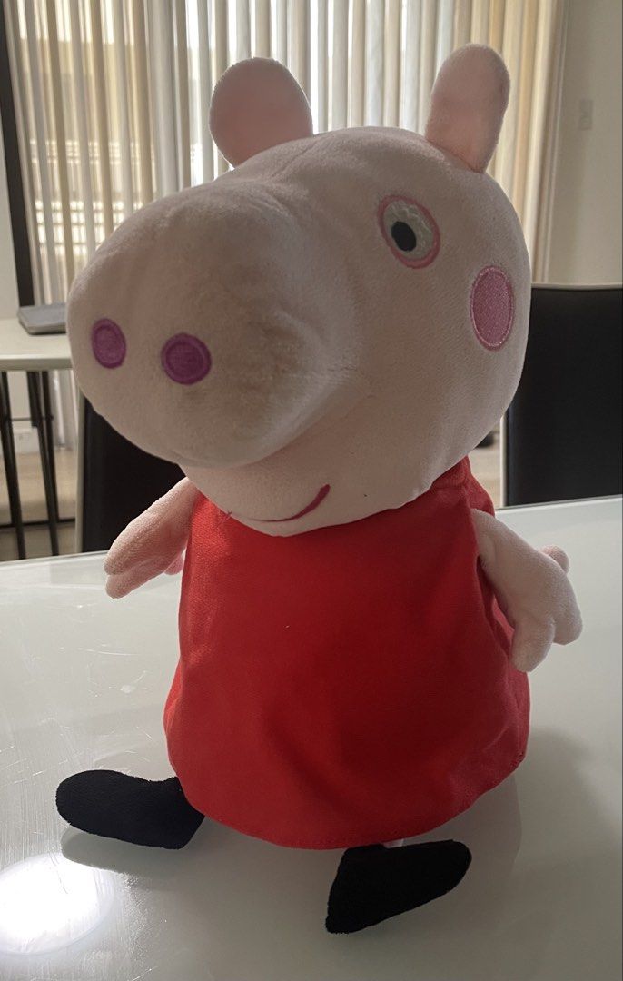 Peppa Pig Plush Toy (Category: Plushies & Soft Toys) located in Taguig. Submitted by declutteringmom314 (Listing ID 1422711194, Image 1). Description: - original - mall bought Peppa Pig plush toy - Features Peppa in a red dress.