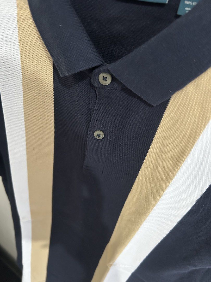 Perry Ellis Striped Polo Shirt (Category: Tshirts & Polo Shirts ) located in Mandaluyong City. Submitted by ncooooooo (Listing ID 1422629649, Image 2). Description: Perry Ellis polo shirt Best fit for Small to Medium (Slim Fit) W: 18” L: 25.5” - Color: Navy blue with beige and white vertical stripes - Size: Small - Material: 100% cotton - Features: Classic collar, two-button placket, short sleeves - Fit: Slim Fit USED ONCE only. Like new. Too sli