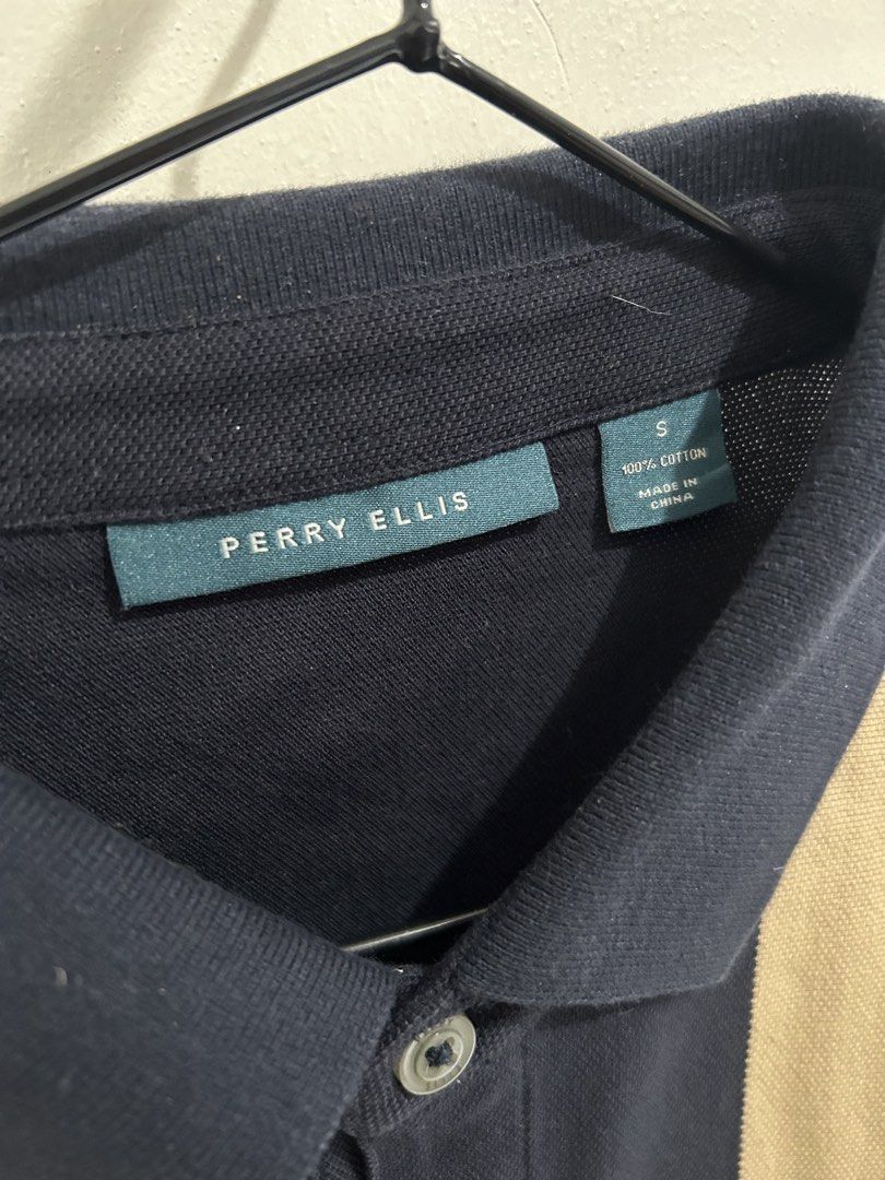 Perry Ellis Striped Polo Shirt (Category: Tshirts & Polo Shirts ) located in Mandaluyong City. Submitted by ncooooooo (Listing ID 1422629649, Image 3). Description: Perry Ellis polo shirt Best fit for Small to Medium (Slim Fit) W: 18” L: 25.5” - Color: Navy blue with beige and white vertical stripes - Size: Small - Material: 100% cotton - Features: Classic collar, two-button placket, short sleeves - Fit: Slim Fit USED ONCE only. Like new. Too sli