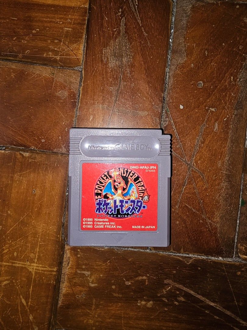 Pocket Monsters Trainer Game Boy Cartridge (Category: Nintendo) located in General Santos City (Dadiangas). Submitted by pactoderetro (Listing ID 1422551772, Image 1). Description: - Pocket Monsters Trainer game cartridge for Game Boy. - Features a red label with Japanese text and graphics. - Gray cartridge. - Made in Japan. - Ideal for retro gaming collectors..