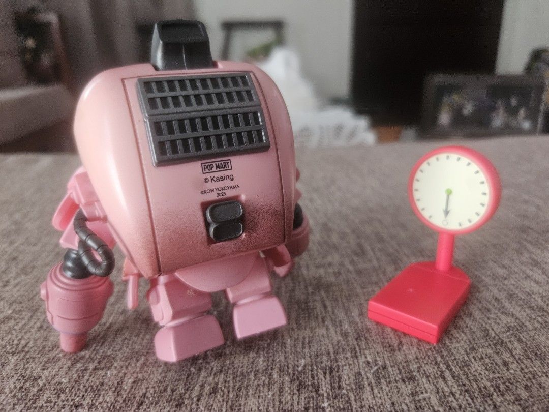Pop Mart x Kasing Bunny Robot Figure (Category: Designer & Blind Box Toys) located in Manila. Submitted by declutterhopper (Listing ID 1422611717, Image 2). Description: - Pink bunny robot collectible figure - Includes matching red scale - Detailed design with bunny face and robot body - Features Pop Mart logo and model information - Ideal for collectors.