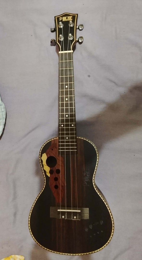Pulse Ukulele (Category: Musical Instruments) located in Manila. Submitted by the_simple_things (Listing ID 1422657134, Image 3). Description: Pulse brand Concert Ukulele. Ovation style design. With free Acouway carrying case. Very good condition. Like new. Original price when bought was 2k.