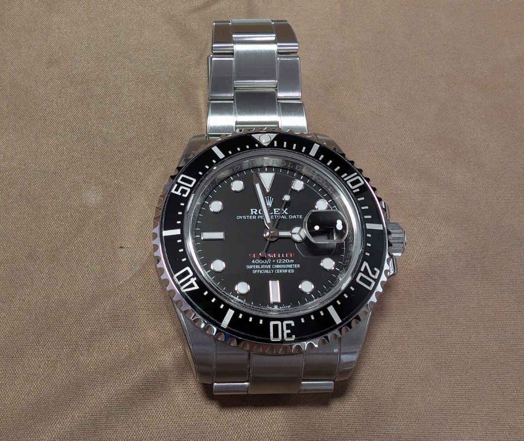 Rolex Sea Dweller 126600-0002 (Category: Watches) located in Singapore. Submitted by zronigel (Listing ID 1422635523, Image 2). Description: - Authentic Rolex Sea Dweller 126600-0002 - Includes original box, manual, booklet, warranty card, green & white tag. - Comes with extra links. - Features a sleek black dial. - Stainless steel bracelet. - Watch Armour protection film applied. - Warranty dated July 2023. - Without the watch box outer sleeve. 