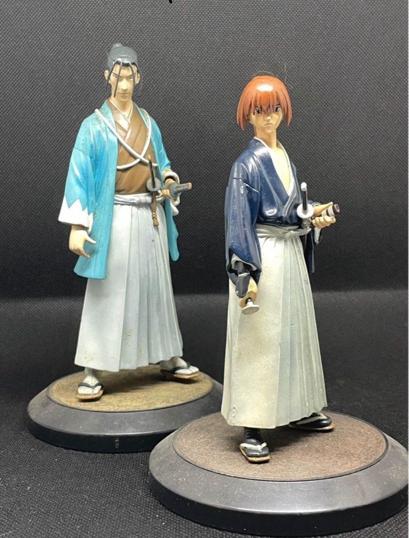 Rurouni Kenshin Anime Figurines (Category: Figurines & Statues) located in Makati City. Submitted by curated_finds73 (Listing ID 1422667347, Image 1). Description: - Rurouni Kenshin figurine set (2 figures). - Features Kenshin Himura and Saito Hajime - Includes round display bases. - Detailed paintwork. - Made of durable material. - Figures are in traditional Japanese attire and holding swords. - No box wyswyg.