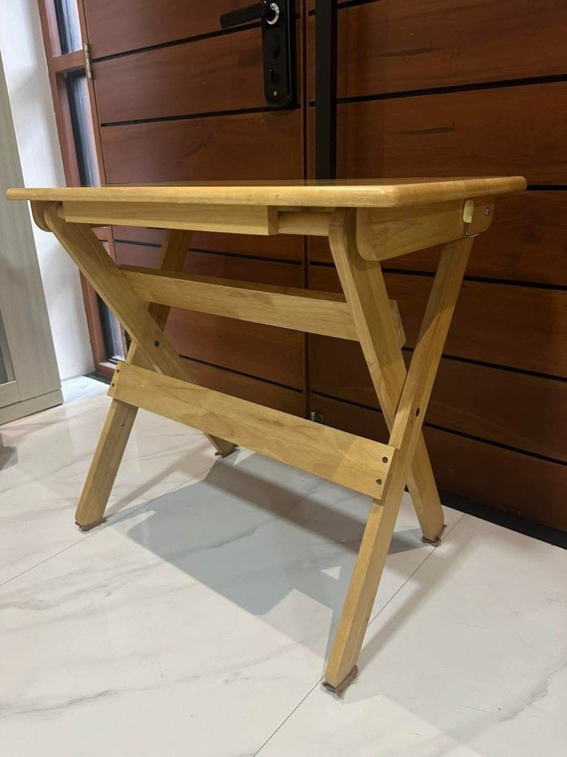 Solid Wood Folding Table (Category: Tables & Sets) located in Quezon City. Submitted by dannikkishoppe2 (Listing ID 1422677947, Image 3). Description: Solid Wood Folding Table ‼️₱3800‼️ *’study nook" or portable desk Good as new W31in x D17.5in x H28in These are SURPLUS items and not BRAND NEW. Please manage your expectations as there might be minimal flaws. Color may vary due to lighting, it may appear darker or lighter in person. Check photos f