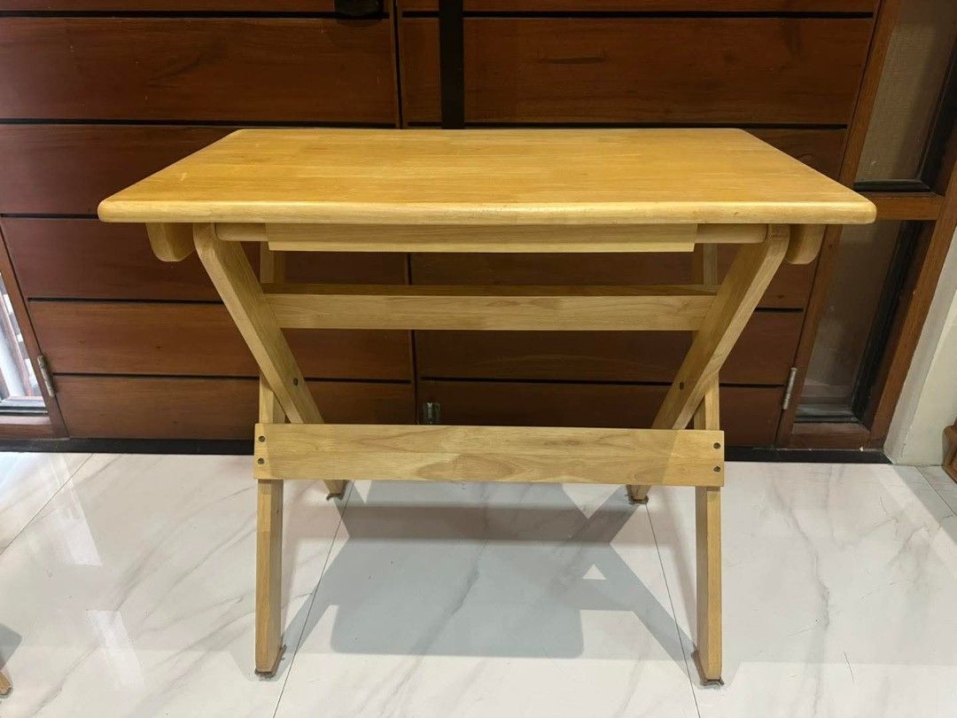 Solid Wood Folding Table (Category: Tables & Sets) located in Quezon City. Submitted by dannikkishoppe2 (Listing ID 1422677947, Image 2). Description: Solid Wood Folding Table ‼️₱3800‼️ *’study nook" or portable desk Good as new W31in x D17.5in x H28in These are SURPLUS items and not BRAND NEW. Please manage your expectations as there might be minimal flaws. Color may vary due to lighting, it may appear darker or lighter in person. Check photos f