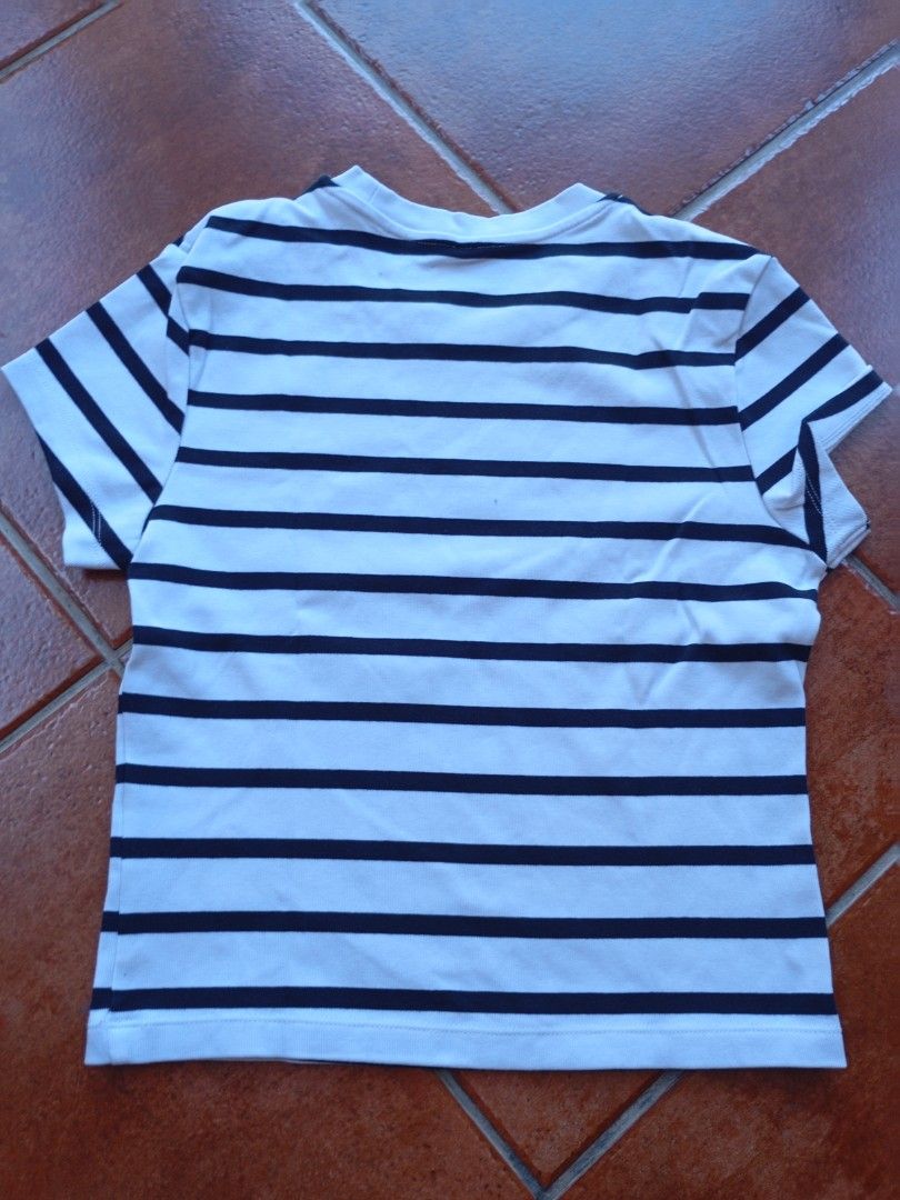 Staple Striped T-shirt (Category: Shirts) located in Manila. Submitted by beenab (Listing ID 1422596253, Image 2). Description: - Classic white and navy blue striped design - Short sleeves - Crew neck - Made of lightweight fabric - Versatile for casual outfits.