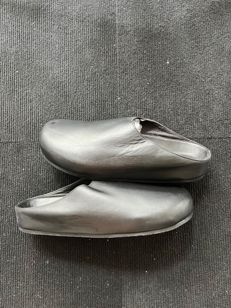 Studio Nicholson Black Sandals Size 43 (Category: Flats & Sandals) located in Davao. Submitted by twistedswagger (Listing ID 1422553556, Image 1). Description: - Studio Nicholson Clogs - Size 43 - Textured soles - Brand name visible on insole.