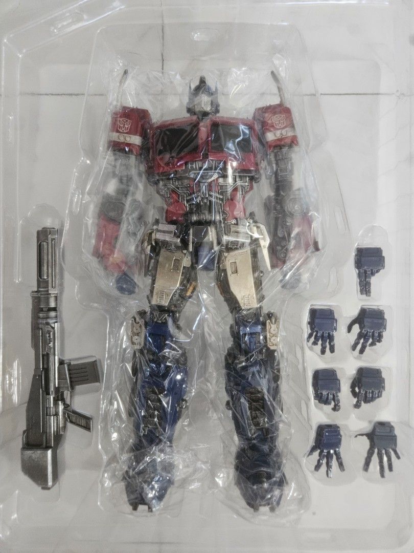 Threezero Transformers Bumblebee DLX Optimus Prime (Category: Figurines & Statues) located in Manila. Submitted by declutterhopper (Listing ID 1422608899, Image 2). Description: - Threezero DLX Optimus Prime collectible figure. - From the Transformers Bumblebee movie. - Includes multiple interchangeable hands. - Comes with a blaster and stand. - Highly detailed and articulated. - In original packaging..