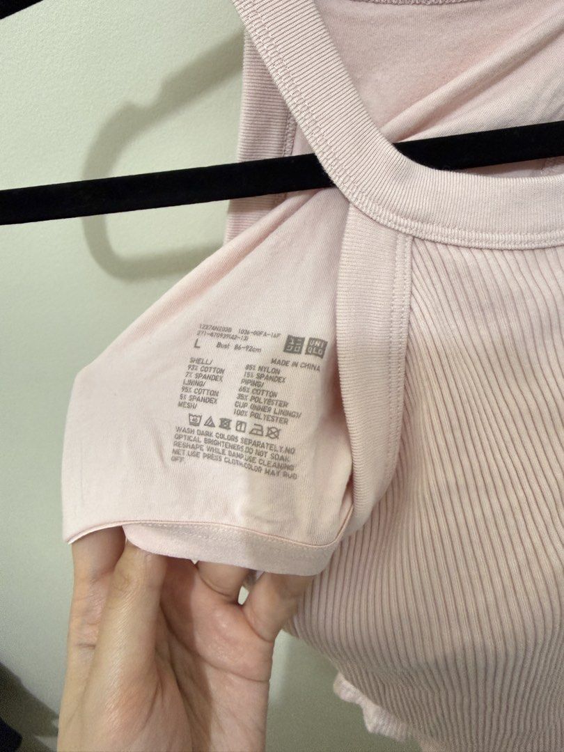 Uniqlo Ribbed Tank Top (Category: Sleeveless) located in Mandaluyong City. Submitted by veronica3000 (Listing ID 1422609410, Image 3). Description: - Uniqlo pink ribbed tank top - Halter neck design - Size: L - Built-in padding - Fitted silhouette - Bust: 86-92cm - Material: Cotton, nylon, spandex blend.
