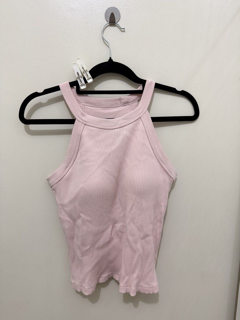 Uniqlo Ribbed Tank Top (Category: Sleeveless) located in Mandaluyong City. Submitted by veronica3000 (Listing ID 1422609410, Image 2). Description: - Uniqlo pink ribbed tank top - Halter neck design - Size: L - Built-in padding - Fitted silhouette - Bust: 86-92cm - Material: Cotton, nylon, spandex blend.