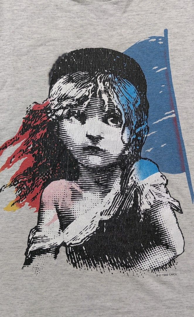 Vintage 90s Les Miserables Graphic Tee (Category: Tshirts & Polo Shirts ) located in Cagayan de Oro. Submitted by james_dig (Listing ID 1422610256, Image 3). Description: -30"x23" - Gray color (pinhole armpit area and minimal crack prints) -need wash - Les Miserables" text on the back - Great for fans of the musical or vintage tees.
