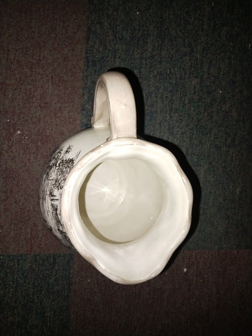 Vintage Ceramic Pitcher (Category: Pitchers & Dispensers) located in Manila. Submitted by hellow2024 (Listing ID 1422594879, Image 1). Description: french country with hand painted design pitcher bought in I.s Vintage ceramic pitcher - Classic design - Features a handle and wide opening - White with black and white design - Decorative piece - Suitable for serving beverages or display.