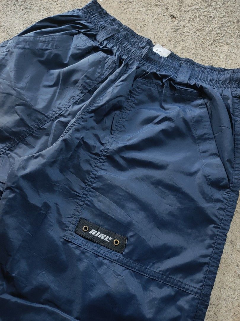 Vintage Nike Navy Blue Track Pants (Category: Joggers) located in Tumauini. Submitted by ken_thrift (Listing ID 1422688169, Image 3). Description: VINTAGE NIKE TRACK PANTS Waistline 27-34 Length 27 issue ❌ Likenew condition Color rate 9.8/10 Price 📥📥.