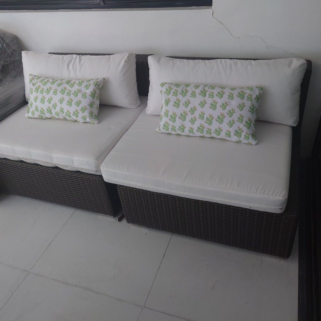 Wicker Outdoor Sofa with Cushions (Category: Sofas) located in Makati City. Submitted by ppomidyar (Listing ID 1422642232, Image 2). Description: - High-end two (2) Fink module wicker-style seats - White cushions and backrests - Finish: Metallic Bronze - Includes decorative green and white patterned toss pillows - Designed for outdoor use - Comfortable seating - Durable wicker base - Perfect for patio or garden - purchased Php65,000 in 2013 in Ou
