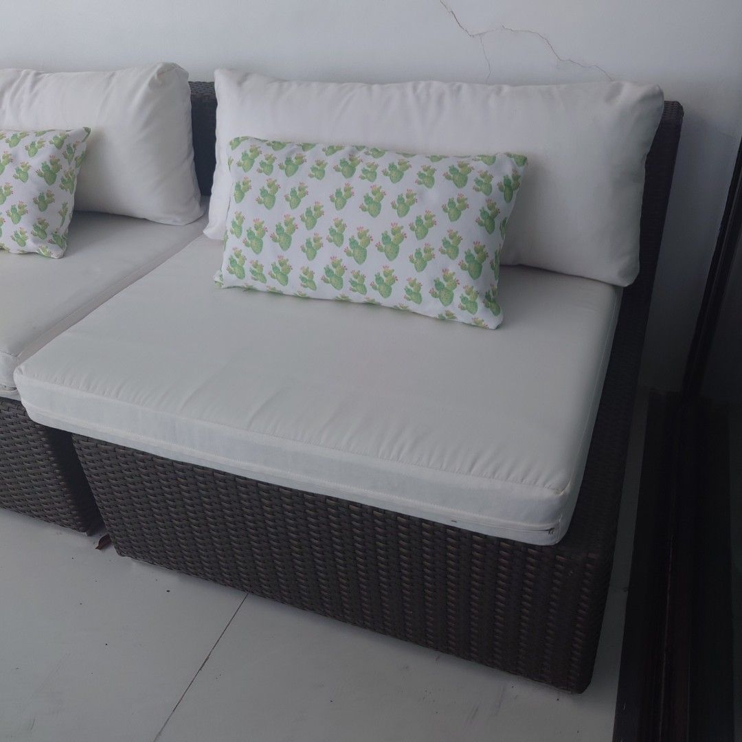 Wicker Outdoor Sofa with Cushions (Category: Sofas) located in Makati City. Submitted by ppomidyar (Listing ID 1422642232, Image 3). Description: - High-end two (2) Fink module wicker-style seats - White cushions and backrests - Finish: Metallic Bronze - Includes decorative green and white patterned toss pillows - Designed for outdoor use - Comfortable seating - Durable wicker base - Perfect for patio or garden - purchased Php65,000 in 2013 in Ou