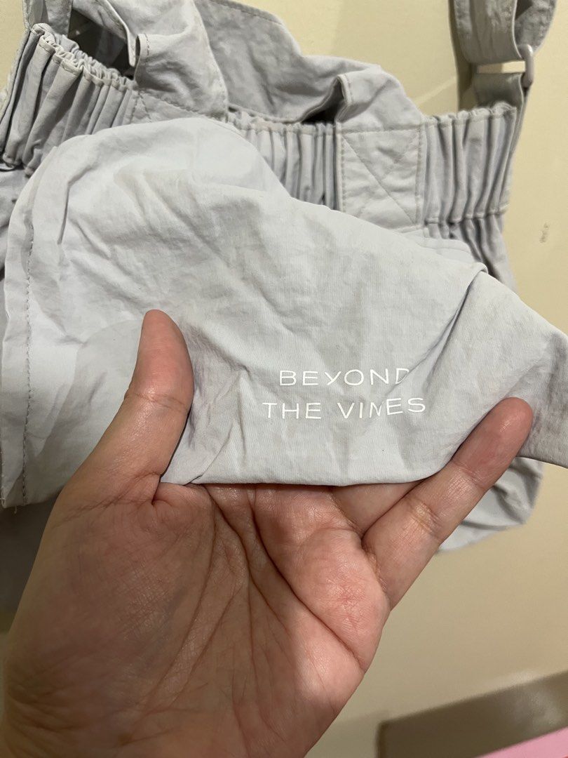 XS BTV light grey Beyond The Vines Dumpling Bag (Category: Cross-body Bags) located in Taguig. Submitted by lil.ac (Listing ID 1422681382, Image 2). Description: Personally bought in Rockwell. Not in a rush to sell Not in a rush to sell. No longer in use since 2022/2023.