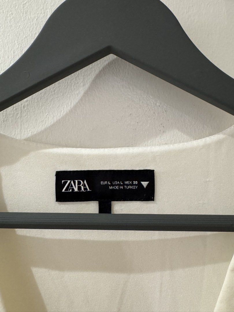 Zara Sleeveless Bow Vest Top (Category: Sleeveless) located in Manila. Submitted by bridgetdrdo (Listing ID 1422595506, Image 2). Description: - Ribboned Top - Dirty White - Perfect for dressing up or dressing down!.