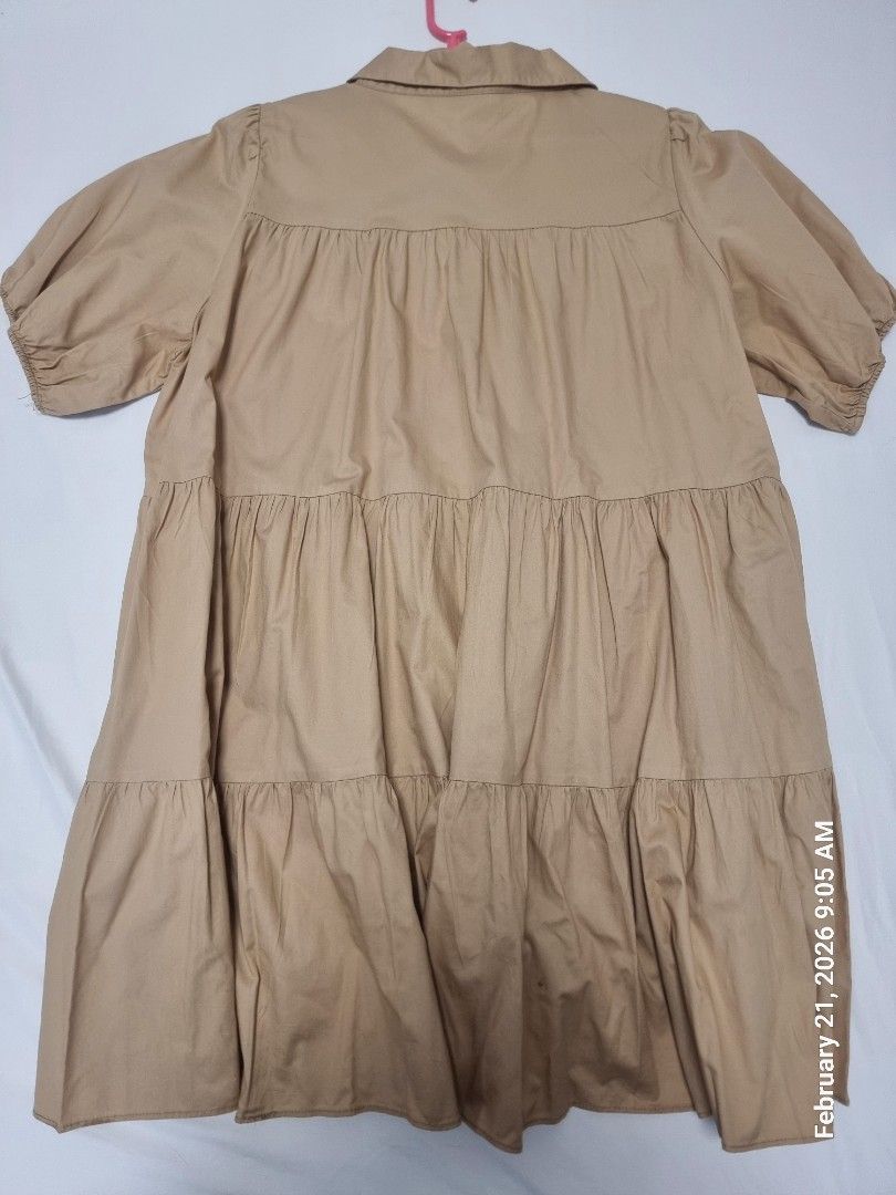 Zara Tiered Dress - Size M (Category: Dresses) located in Antipolo. Submitted by CharliesBox (Listing ID 1422569902, Image 3). Description: - Zara dress - Size: M - Design: Tiered - Sleeves: Short - Neckline: Collared - Closure: Button-down front - Color: Tan - Made in China.