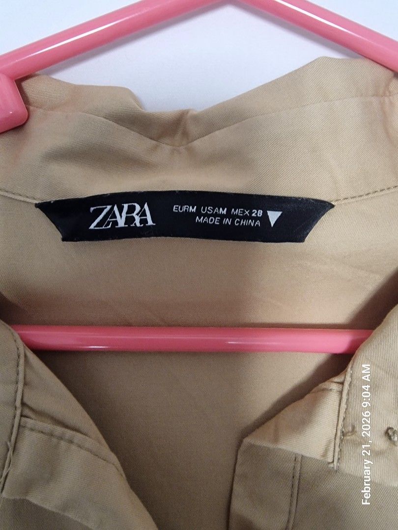 Zara Tiered Dress - Size M (Category: Dresses) located in Antipolo. Submitted by CharliesBox (Listing ID 1422569902, Image 2). Description: - Zara dress - Size: M - Design: Tiered - Sleeves: Short - Neckline: Collared - Closure: Button-down front - Color: Tan - Made in China.