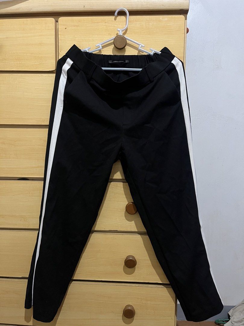 Zara Trafaluc Black Pants with White Stripe (Category: Other Bottoms) located in San Juan, La Union. Submitted by mirrorball27 (Listing ID 1422669502, Image 1). Description: ✨ PLEASE READ BEFORE ORDERING ✨ Item Details: Zara Trafaluc black pants with white side stripes. Size XS. Elastic waistband. Made in Turkey. Features two back pockets. ✔️ Actual photos posted ✔️ “When worn” photos/videos will be sent upon request 📦 Shipping Details • Shippin
