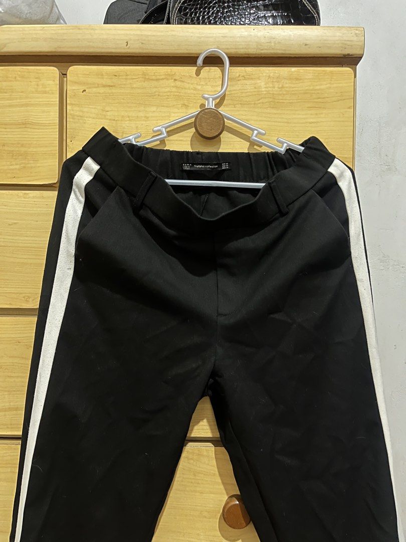 Zara Trafaluc Black Pants with White Stripe (Category: Other Bottoms) located in San Juan, La Union. Submitted by mirrorball27 (Listing ID 1422669502, Image 2). Description: ✨ PLEASE READ BEFORE ORDERING ✨ Item Details: Zara Trafaluc black pants with white side stripes. Size XS. Elastic waistband. Made in Turkey. Features two back pockets. ✔️ Actual photos posted ✔️ “When worn” photos/videos will be sent upon request 📦 Shipping Details • Shippin