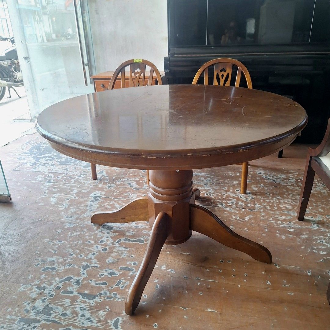 2nd hand Pedestal Round Wooden Dining Table (Category: Tables & Sets) located in Paranaque City. Submitted by 2ndcharmfurniture (Listing ID 1422741148, Image 3). Description: Round wooden dining table with a pedestal base. The table has a dark brown finish. Dimensions are D106cm and H71cm. It is suitable for a dining area or kitchen. The table is sturdy and can accommodate multiple diners. It is a classic design that will complement various inter