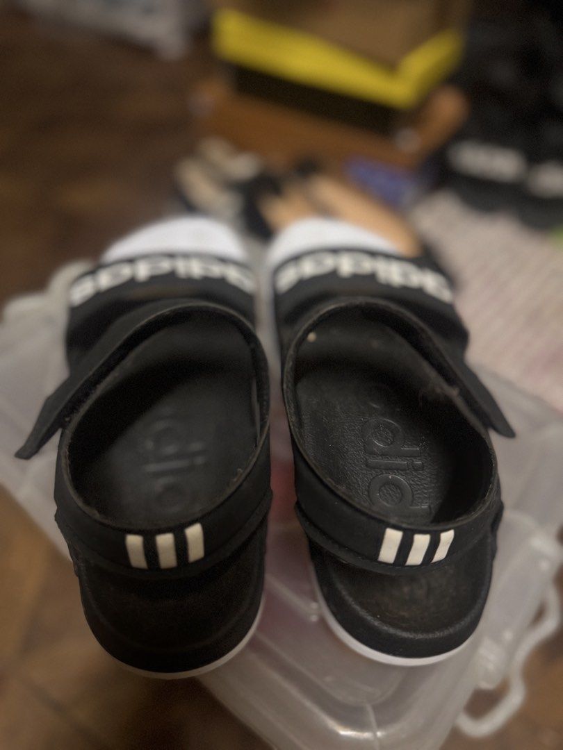 Adidas Sandals (Category: Flats & Sandals) located in Las Pinas. Submitted by declutterverse (Listing ID 1422872742, Image 3). Description: - Adidas sandals - Black strap with white sole - Adidas logo on strap and back - Adjustable straps.