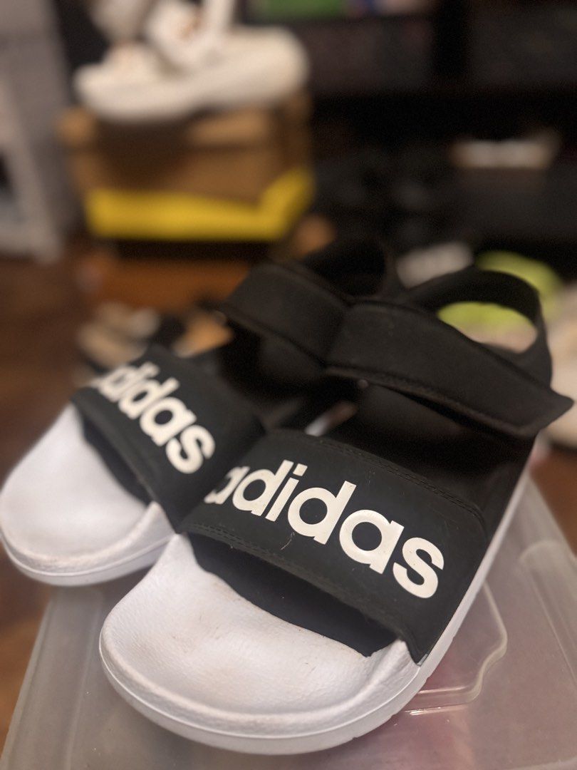 Adidas Sandals (Category: Flats & Sandals) located in Las Pinas. Submitted by declutterverse (Listing ID 1422872742, Image 1). Description: - Adidas sandals - Black strap with white sole - Adidas logo on strap and back - Adjustable straps.
