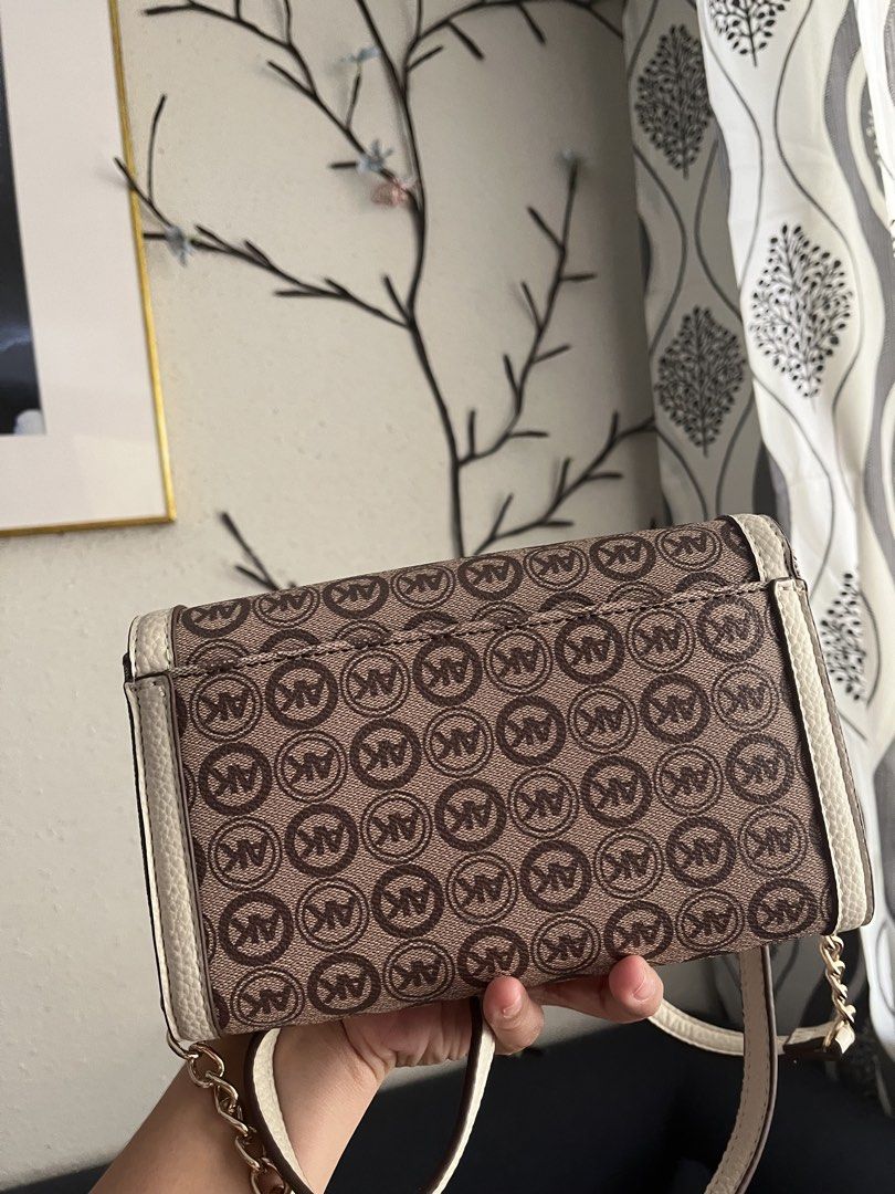 Anne Klein Logo Wallet on a Chain (Category: Luxury Bags & Wallets) located in Manila. Submitted by ronalynrey57532 (Listing ID 1422754007, Image 3). Description: - Anne Klein wallet on a chain - Brown and cream color scheme - Features the AK logo pattern - Detachable strap - Multiple interior compartments - Magnetic closure - Brand new with original tag - MSRP: $58.