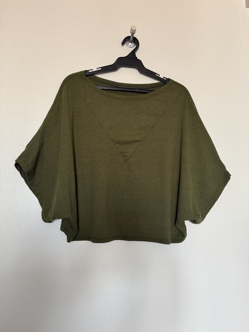 Army green knit top (Category: Blouses) located in Makati City. Submitted by pattystuff (Listing ID 1422766215, Image 1). Description: - Crop top - Best fit M to L - Needs washing - Pre-loved, please manage expectations.