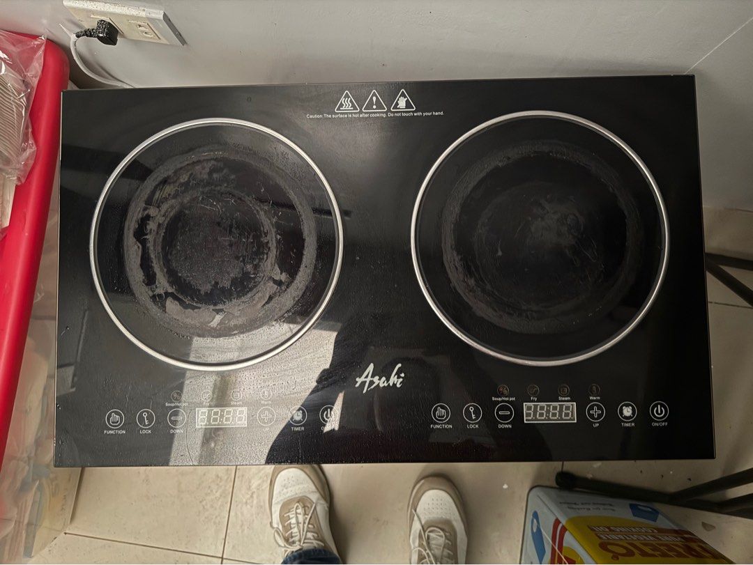 Asahi Double Burner Electric Stove (Category: Cookers) located in Makati City. Submitted by beguiling (Listing ID 1422887478, Image 1). Description: - Asahi double burner electric stove - Two cooking zones - Digital display and touch controls - Function, lock, timer, and power buttons - Ideal for small kitchens or as an extra cooking appliance.