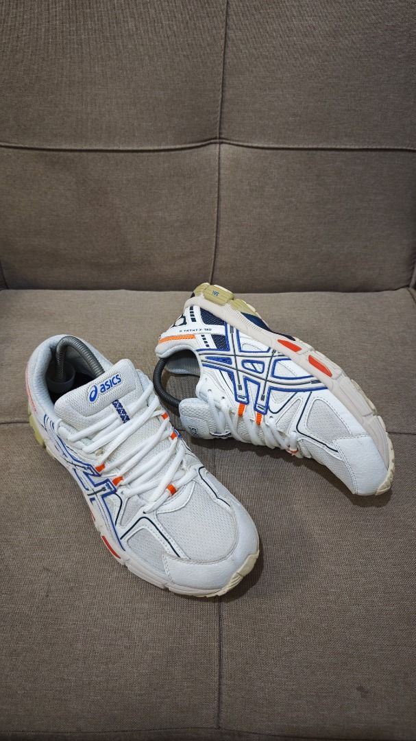 ASICS Gel-Kahana 8 (Category: Sneakers) located in Malungon. Submitted by thrift_side (Listing ID 1422814417, Image 2). Description: - ASICS Gel-Kahana 8 - Color: White with blue and orange accents - Size: US 9 1/2 / EURO 43.5 - Made in Indonesia - Condition: Visible wear on soles, uppers, and insoles DISCLAIMER: Item color may slightly vary due to photographic lighting sources..