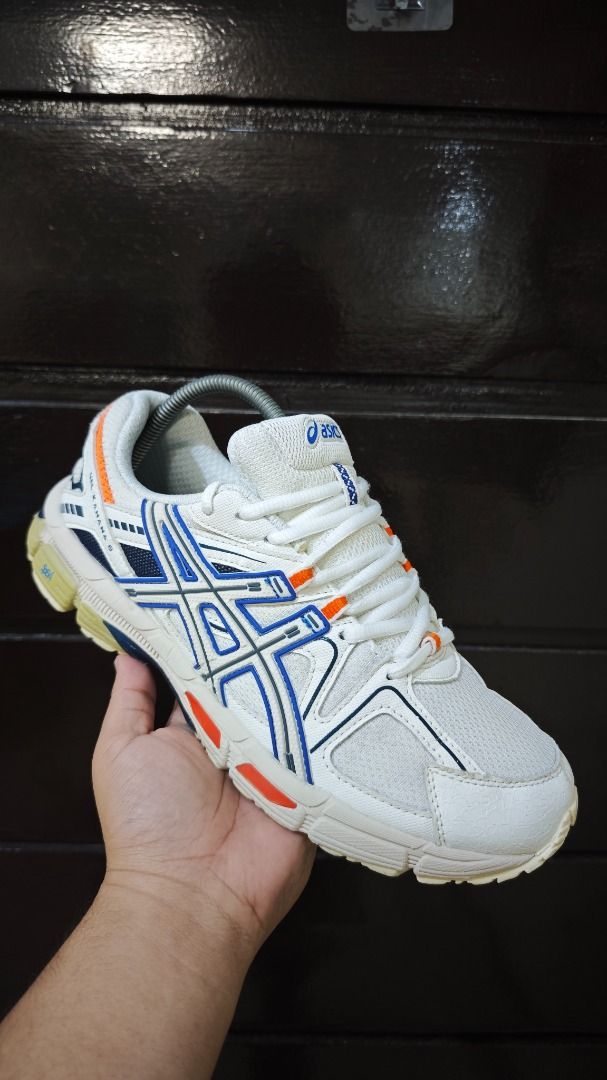 ASICS Gel-Kahana 8 (Category: Sneakers) located in Malungon. Submitted by thrift_side (Listing ID 1422814417, Image 1). Description: - ASICS Gel-Kahana 8 - Color: White with blue and orange accents - Size: US 9 1/2 / EURO 43.5 - Made in Indonesia - Condition: Visible wear on soles, uppers, and insoles DISCLAIMER: Item color may slightly vary due to photographic lighting sources..