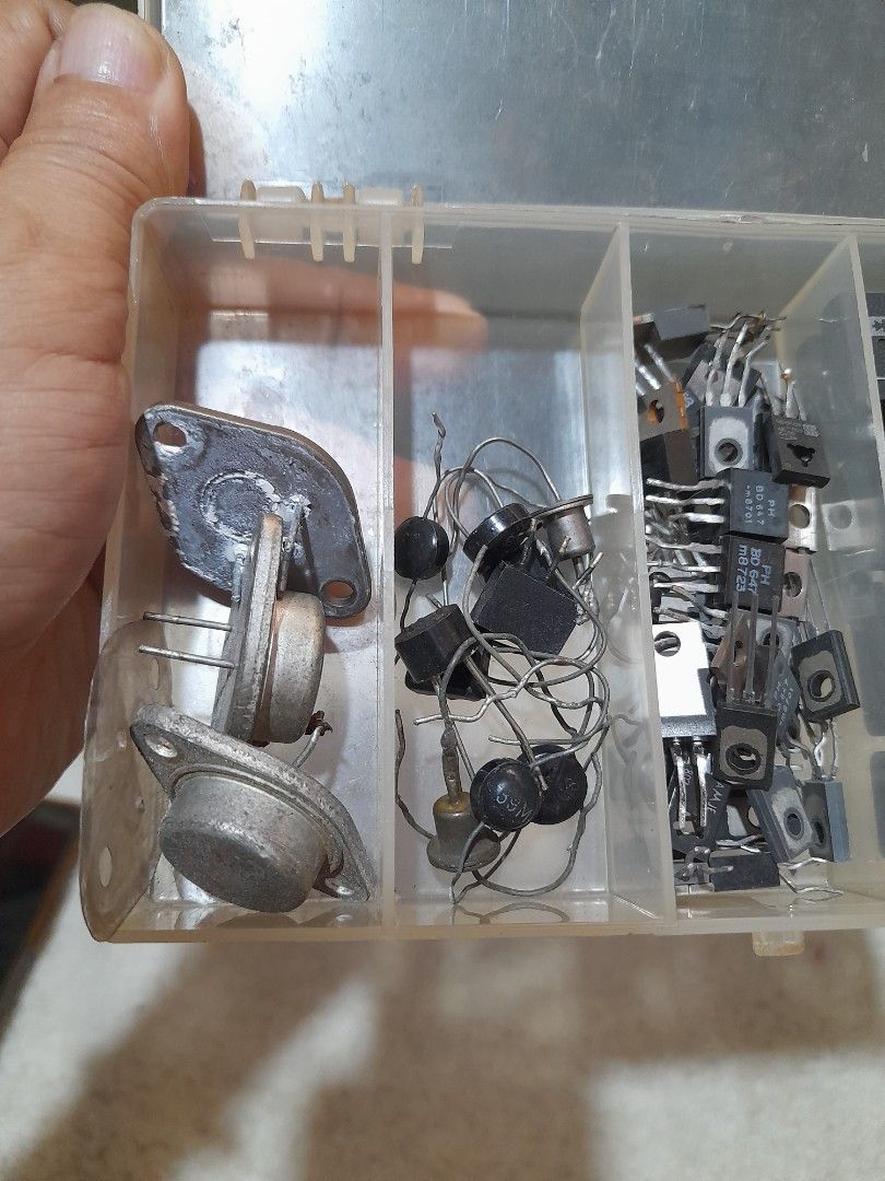 Assorted Electronic Components in Storage Box (Category: Soundbars, Speakers & Amplifiers) located in Bocaue. Submitted by marajapansurplus (Listing ID 1422773294, Image 3). Description: - Japan sourced item - selling as it is - Electronics components kit. - Includes diodes, transistors, and integrated circuits. - Organized in a clear plastic storage box. - Variety of sizes and types. - Suitable for electronics projects and repairs. - Box has mul