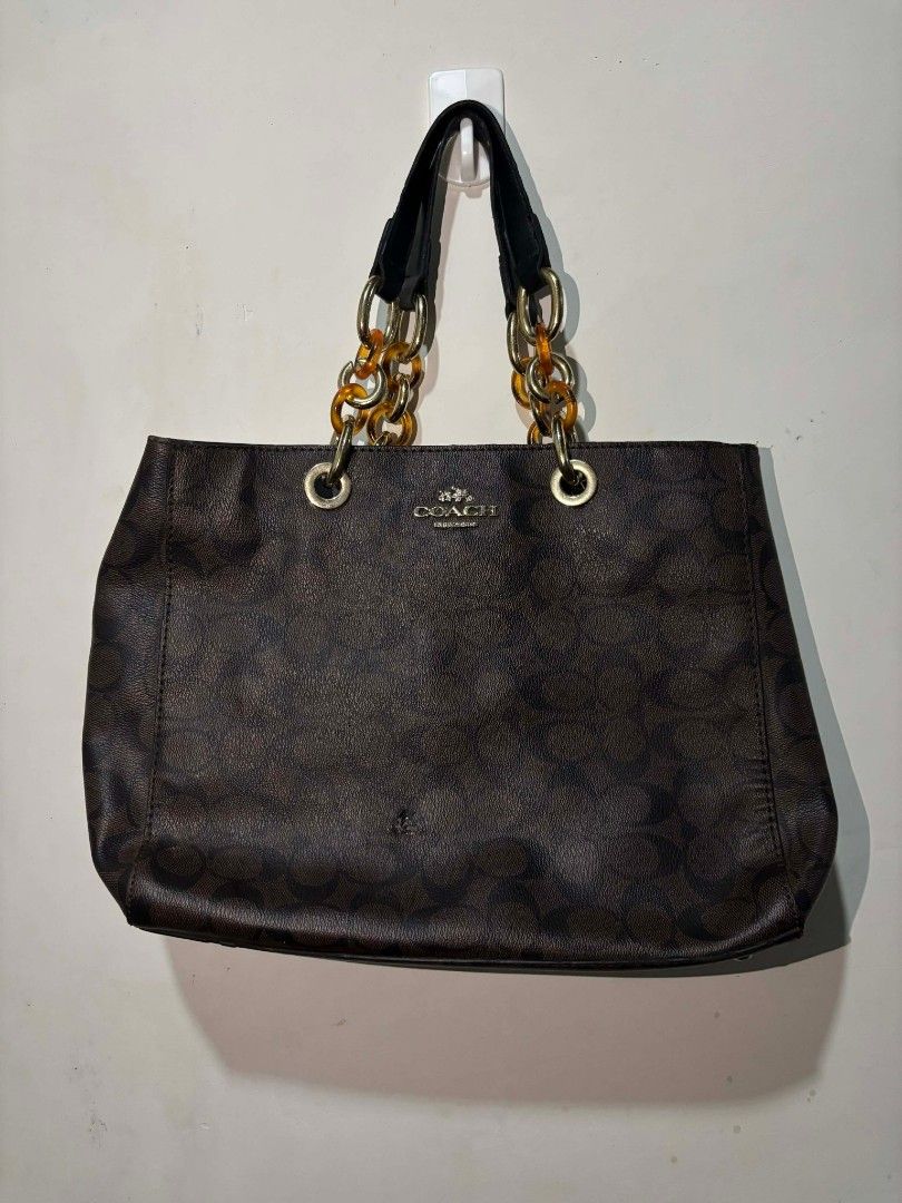 Authentic Coach Signature Leather Monogram Handbag (Category: Luxury Bags & Wallets) located in Naga. Submitted by hubthrift (Listing ID 1422868888, Image 1). Description: AUTHENTIC One Dot Burn Issue.