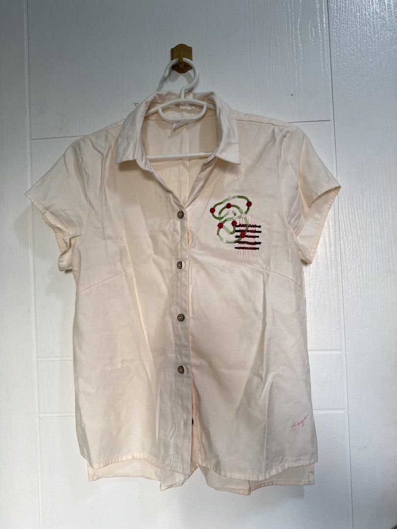 Bayo Embroidered Shirt - Small (Category: Shirts) located in Pasig City. Submitted by pupperiedoo (Listing ID 1422753009, Image 1). Description: - Bayo cream-colored shirt - Size: Small - Features an embroidered design - Short sleeves - Button-down closure - Collared neckline.
