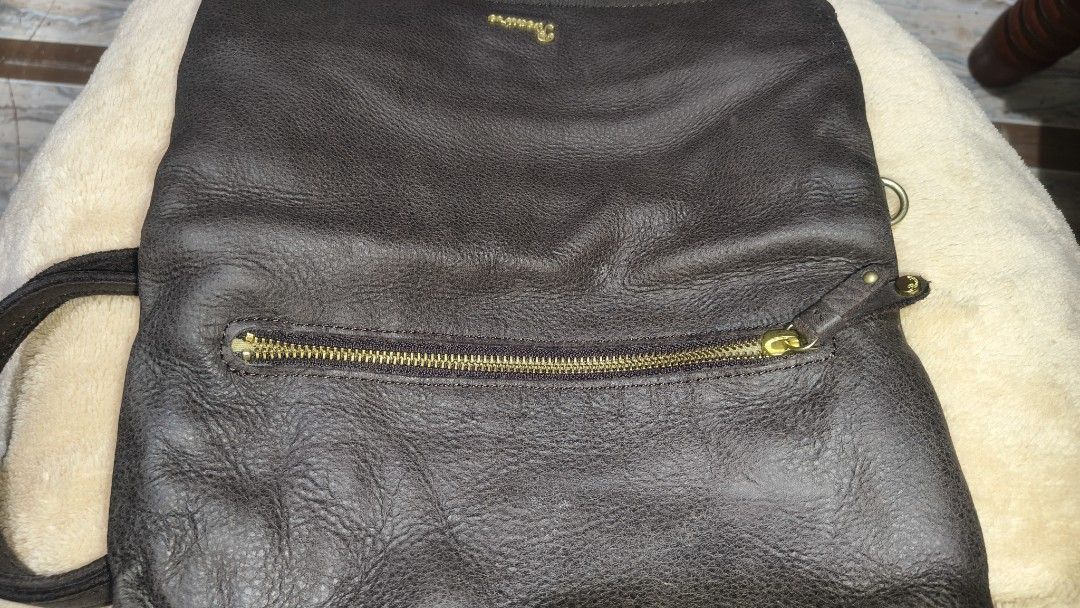 Beaure Brown Leather Sling/Shoulder bag with Leopard Print (Category: Luxury Bags & Wallets) located in Tanza. Submitted by declutterolshoppe (Listing ID 1422835227, Image 3). Description: - Stylish brown leather sling/shoulder bag - Unique leopard print accent - Fold-over flap with magnetic snap - Detachable shoulder strap - Interior zippered pocket - Spacious main compartment - Elegant gold-toned hardware - Perfect for everyday or special event