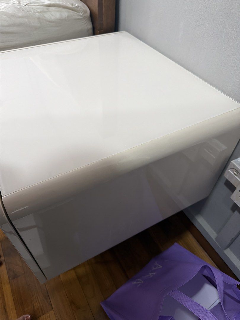 Bedside table (Category: Tables & Sets) located in Singapore. Submitted by avarey1985 (Listing ID 1422816194, Image 3). Description: Bedside table Solid wood with tempered glass on top Beige/cream with walnut Wooden legs in walnut Self collection.