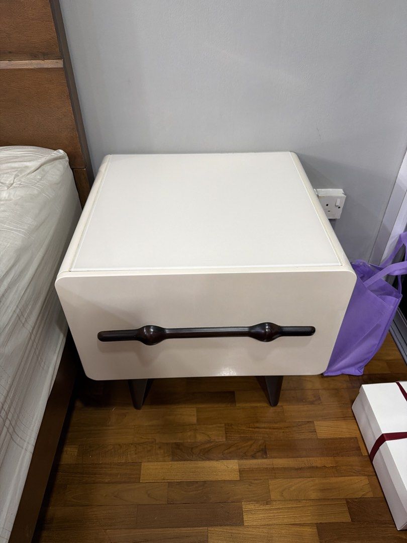 Bedside table (Category: Tables & Sets) located in Singapore. Submitted by avarey1985 (Listing ID 1422816194, Image 1). Description: Bedside table Solid wood with tempered glass on top Beige/cream with walnut Wooden legs in walnut Self collection.