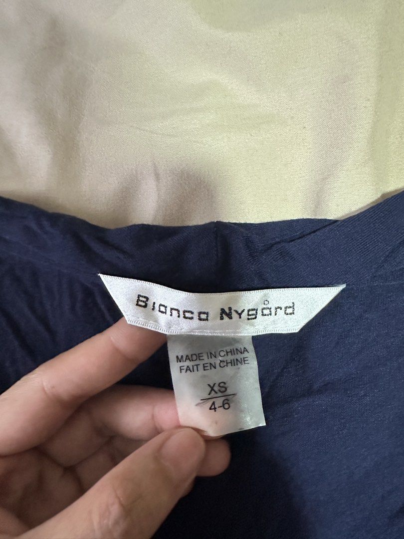 Bianco Nygaard Navy Wrap Top XS (Category: Blouses) located in Tabuk. Submitted by classicseconds (Listing ID 1422767703, Image 3). Description: .