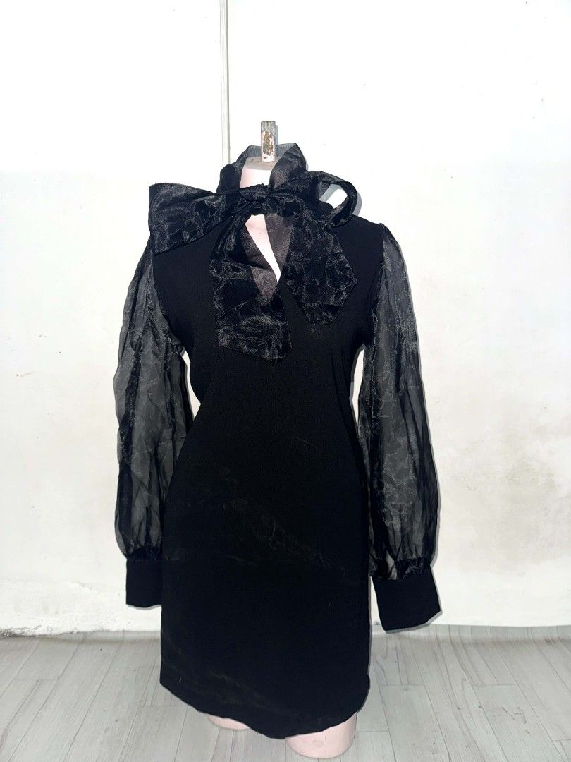 Black Dress with Bow Detail (Category: Dresses) located in Malabon City. Submitted by WanderThingsPH (Listing ID 1422833649, Image 2). Description: - Black dress with bow neckline - Features sheer sleeves - Fitted silhouette - Made of soft, comfortable fabric - Versatile for various occasions #goth.