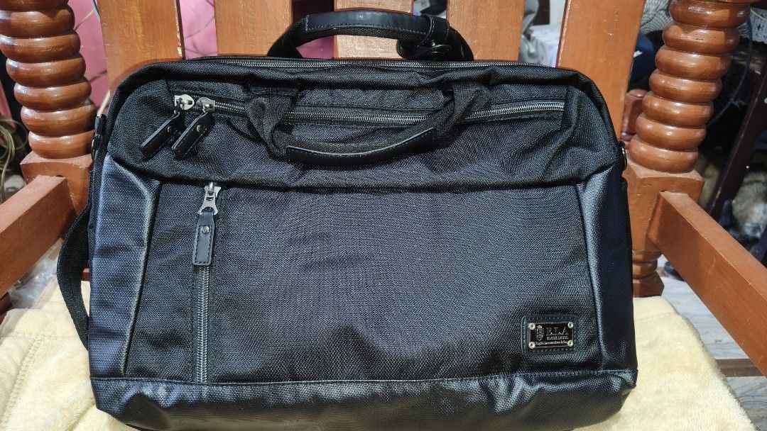 Black Laptop Bag (backpack, shoulder) (Category: Laptop Bags & Sleeves) located in Tanza. Submitted by declutterolshoppe (Listing ID 1422775391, Image 2). Description: - Black laptop bag (backpack, shoulder) - Multiple compartments for organization - Includes a handle and detachable shoulder strap - Sleek design with textured exterior - Zippered closure - Made of durable material - Interior pockets for organization.