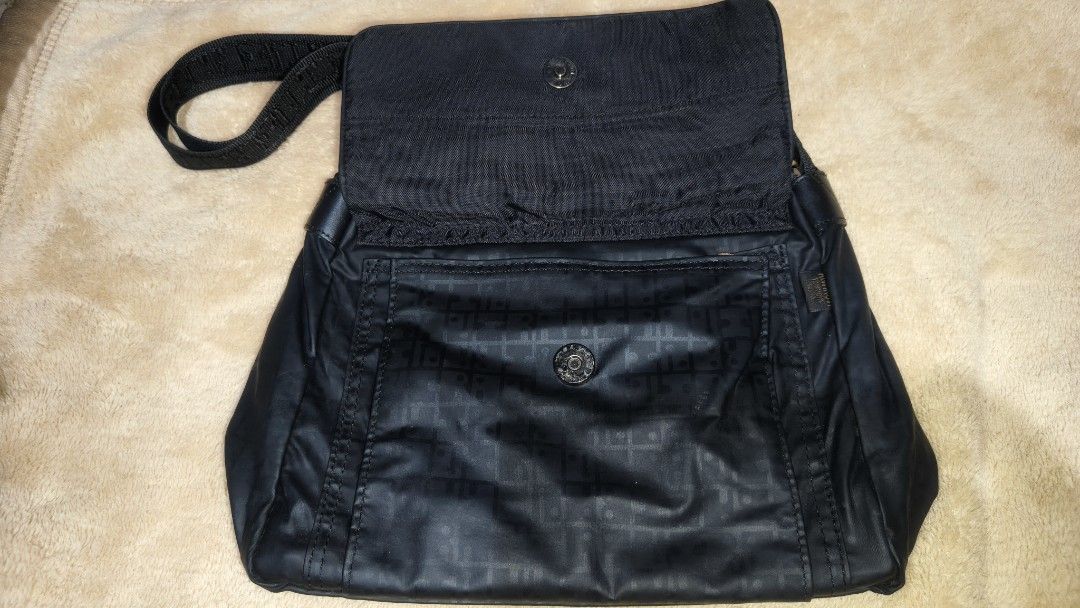 Black Messenger Bag with Multiple Compartments (Category: Sling Bags) located in Tanza. Submitted by declutterolshoppe (Listing ID 1422826572, Image 2). Description: - Black messenger bag - Adjustable shoulder strap - Multiple compartments for organization - Front pocket for easy access - Interior pockets for valuables - Secure flap closure with snap button - Front zipper pocket - Durable, long-lasting material - Stylish design with a lighter bro