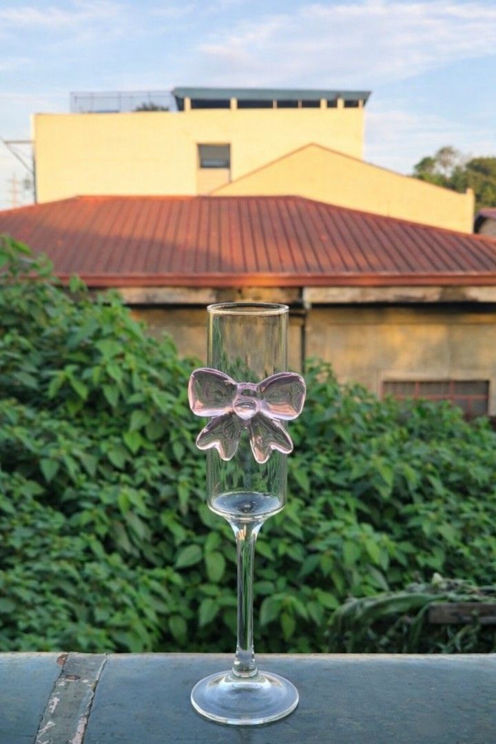Champagne Flute with Bow Accent (Category: Dinnerware & Cutlery) located in Caloocan City. Submitted by mommymoon71 (Listing ID 1422810218, Image 1). Description: - Elegant champagne flute - Features a decorative bow accent - Slender stem and clear design - Ideal for special occasions - Adds sophistication to your table.
