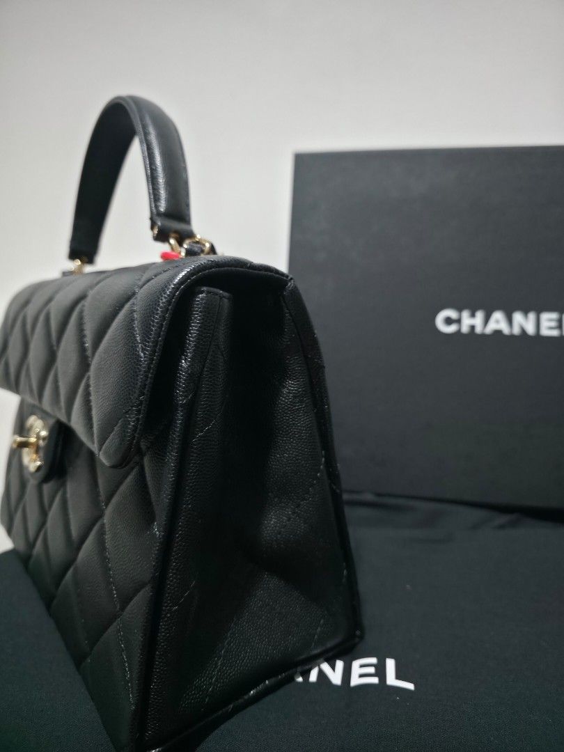[With receipt] Chanel Quilted Bag (Category: Luxury Bags & Wallets) located in Makati City. Submitted by qwn009 (Listing ID 1422825802, Image 2). Description: - Authentic Chanel handbag - Color: Black - Design: Quilted - Features: Top handle and chain strap - Includes: Box and dust bag, paper bag, receipt - Details: Classic Chanel logo and protective metal feet - first owned bought straight from Europe boutique.