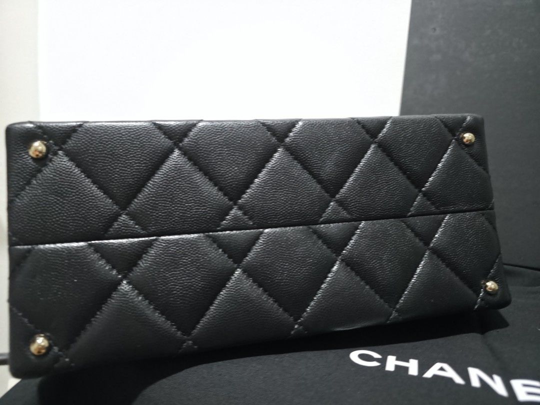 [With receipt] Chanel Quilted Bag (Category: Luxury Bags & Wallets) located in Makati City. Submitted by qwn009 (Listing ID 1422825802, Image 3). Description: - Authentic Chanel handbag - Color: Black - Design: Quilted - Features: Top handle and chain strap - Includes: Box and dust bag, paper bag, receipt - Details: Classic Chanel logo and protective metal feet - first owned bought straight from Europe boutique.