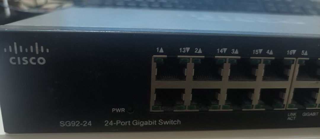 Cisco SG92-24 24-Port Gigabit Switch⁹ (Category: Networking) located in Manila. Submitted by ipstuff23 (Listing ID 1422844517, Image 1). Description: Cisco SG92-24 24-Port Gigabit Switch. Features 24 ports for network connectivity. The switch is a Cisco Small Business product. Model number is SG92-24. It has a power indicator and link/gigabit activity lights. The device is designed for network management and data transfer..