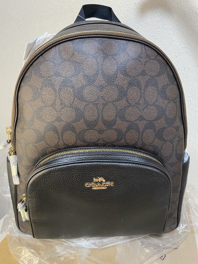 Coach Large Court Backpack (Category: Luxury Bags & Wallets) located in Caloocan City. Submitted by queenveeglamours (Listing ID 1422844960, Image 1). Description: - Large size backpack - Signature canvass in brown color - Elegant gold-tone hardware -Padded back support -Open to layaway ( up to 3 months) -30% Down Payment only .
