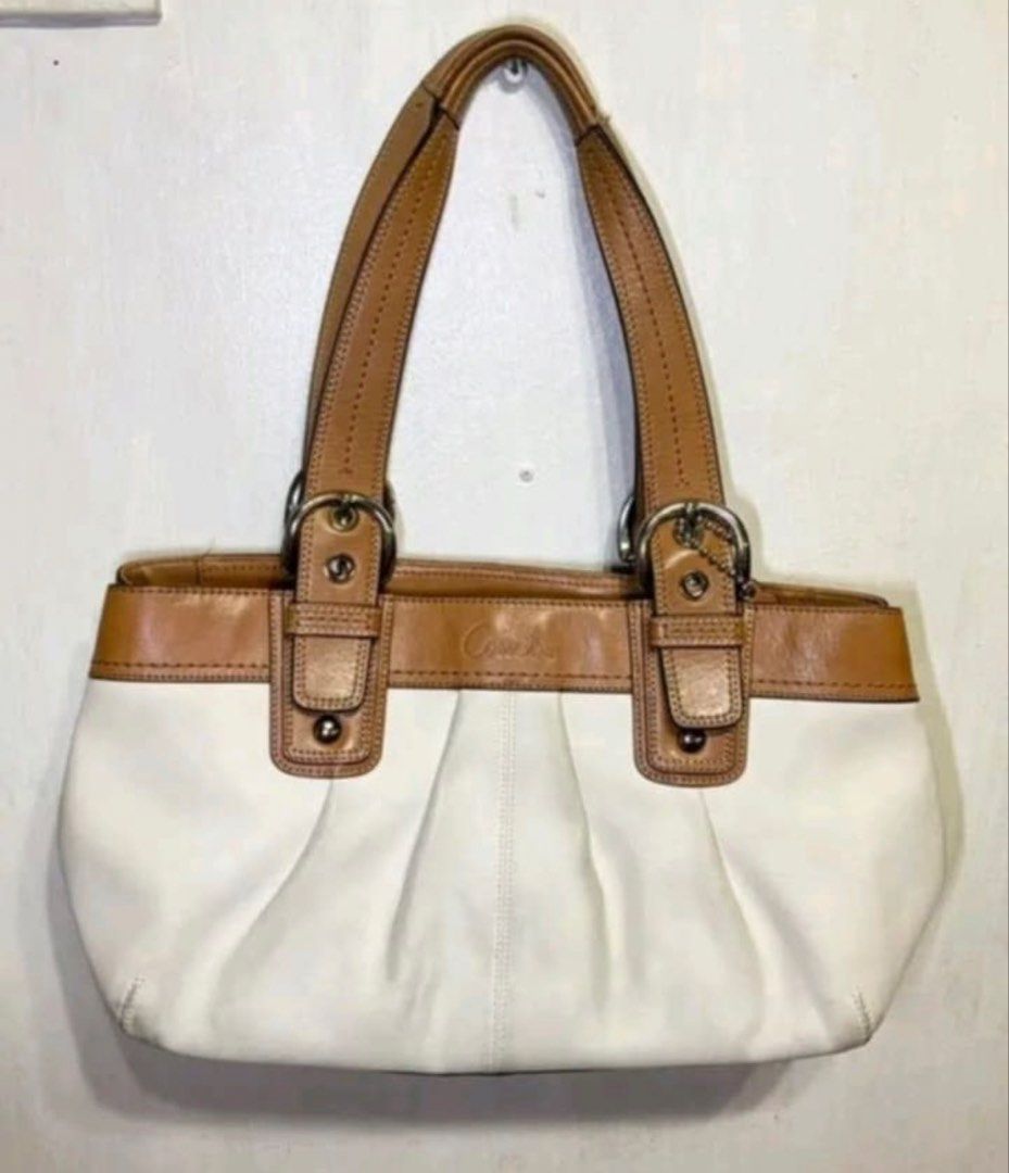Coach Pleated Soho Tote Bag (Category: Luxury Bags & Wallets) located in Manila. Submitted by niniip (Listing ID 1422868156, Image 1). Description: -Authentic Coach Soho Pleated Tote -Need Wash may stain -Decluttering -One of my fave bags •Dimensions: Approximately 14”-18” (L) × 11” (H) × 4”-5.5” (D). • Interior Features: Typically includes a three-compartment design with a large central zippered divider, an additional interior zip pocket, and tw